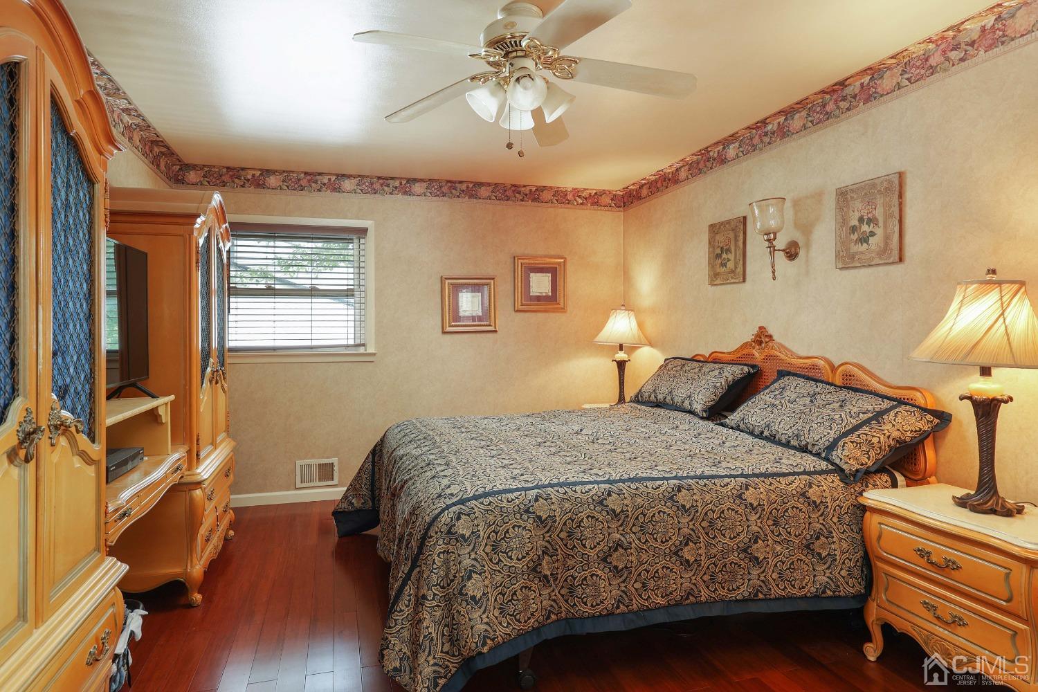 10 Gramercy Road Old Bridge, NJ 08857 - Photo 24 of 31 a bedroom with a bed and wooden floor