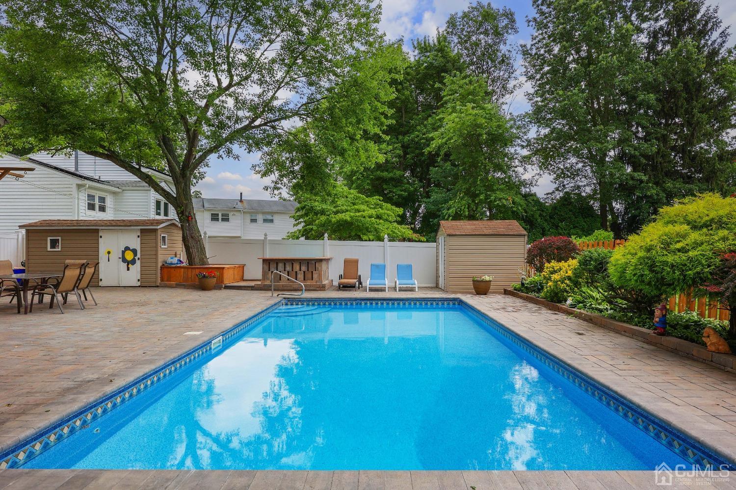 10 Gramercy Road Old Bridge, NJ 08857 - Photo 29 of 31 a view of a swimming pool with an outdoor seating