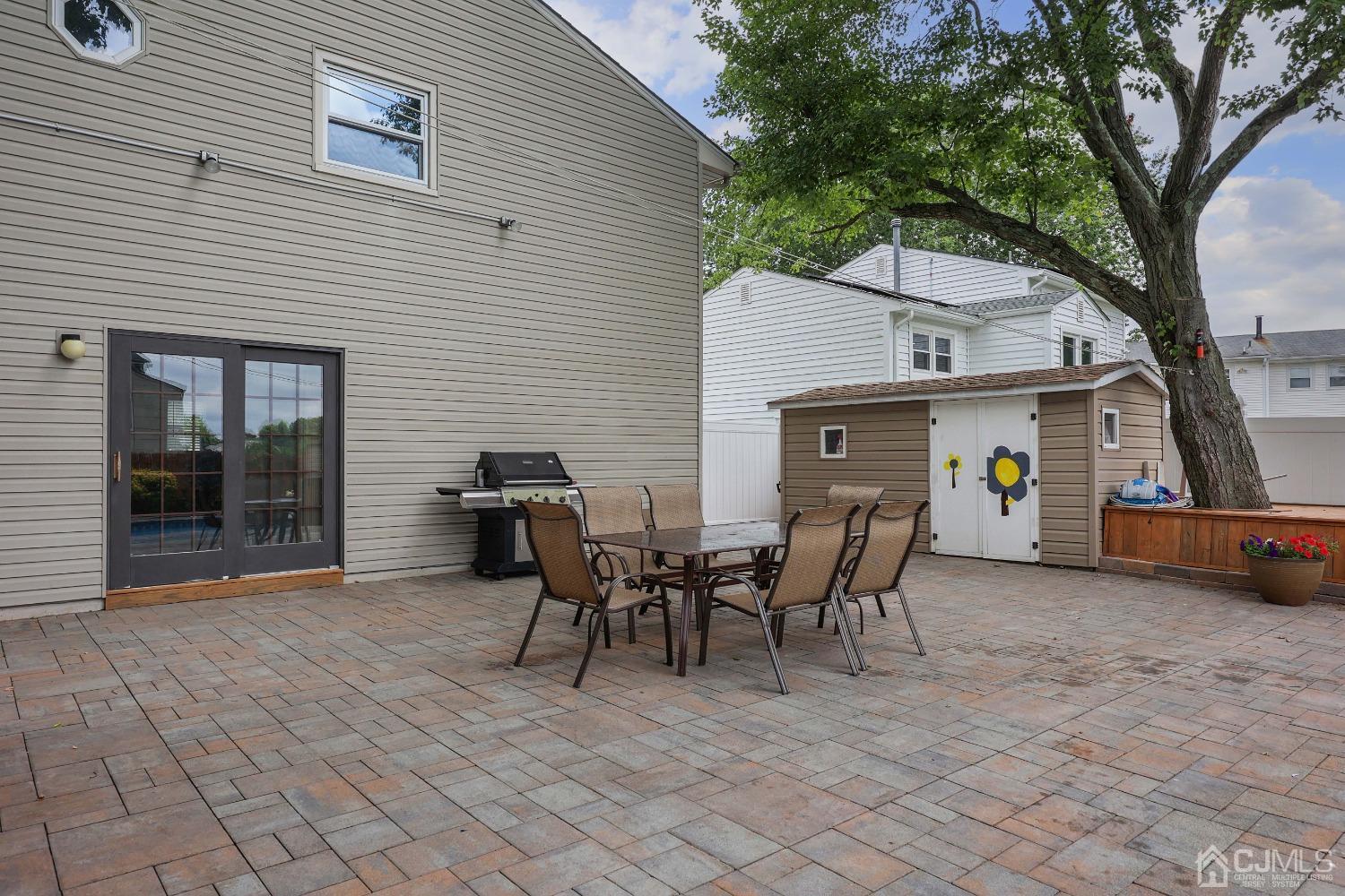 10 Gramercy Road Old Bridge, NJ 08857 - Photo 30 of 31 a view of a patio with table and chairs and potted plants
