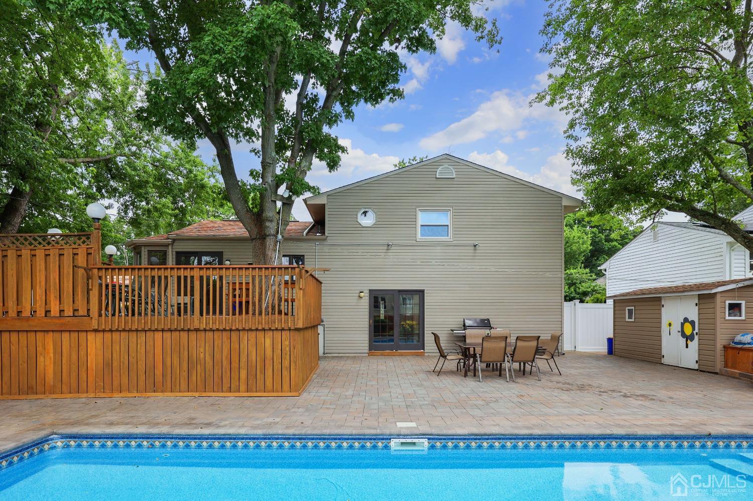 10 Gramercy Road Old Bridge, NJ 08857 - Photo 6 of 31 a view of a house with a patio and a yard