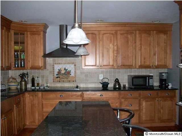 231 Georgia Road Freehold, NJ 07728 - Photo 3 of 3 a kitchen with a sink cabinets and window