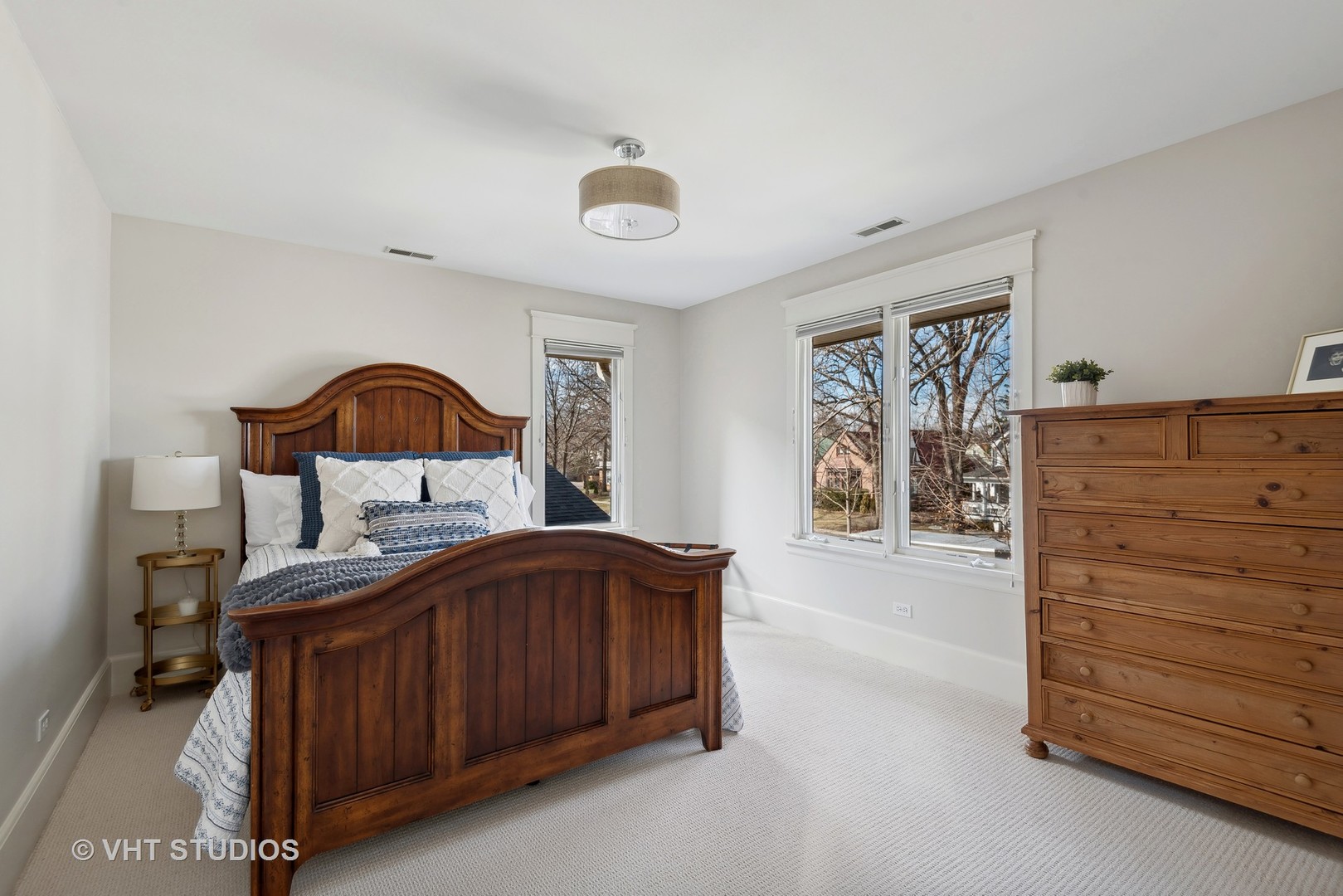 1411 Maple Avenue Wilmette, IL 60091 - Photo 19 of 41 a bedroom with a bed and a dresser