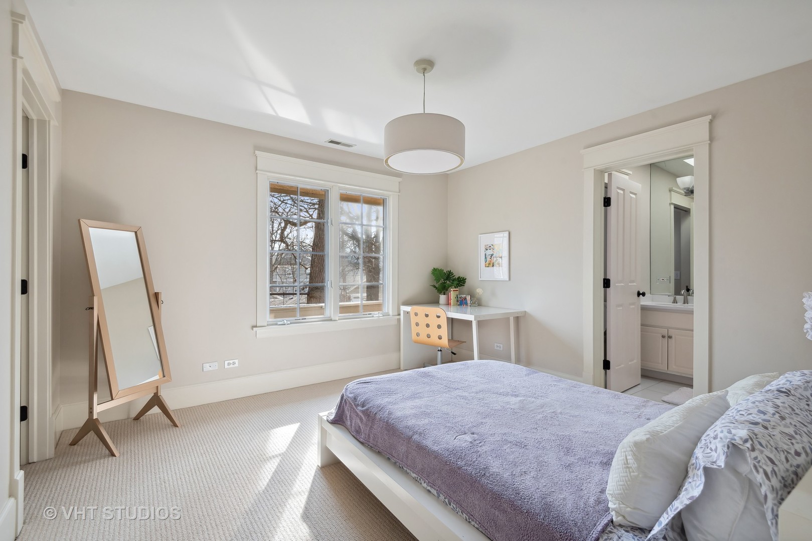 1411 Maple Avenue Wilmette, IL 60091 - Photo 20 of 41 a spacious bedroom with a bed and a chandelier