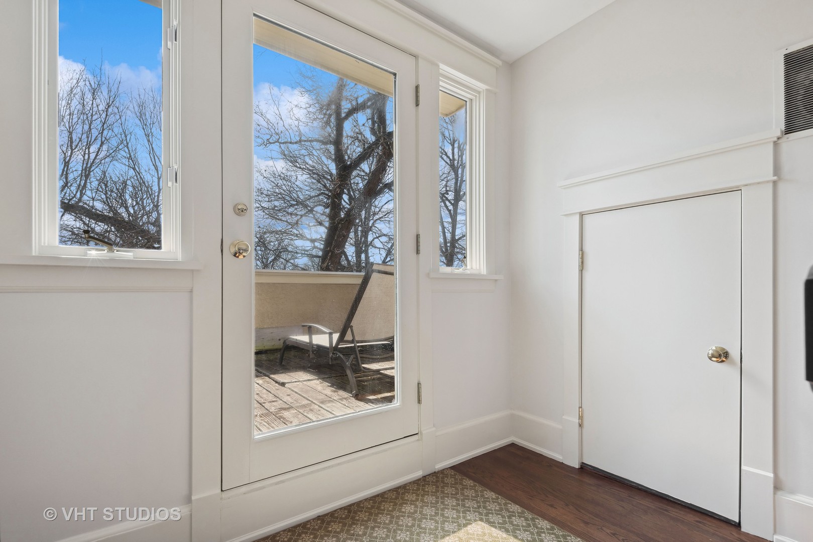 1411 Maple Avenue Wilmette, IL 60091 - Photo 23 of 41 a view of a hallway with wooden floor and a window