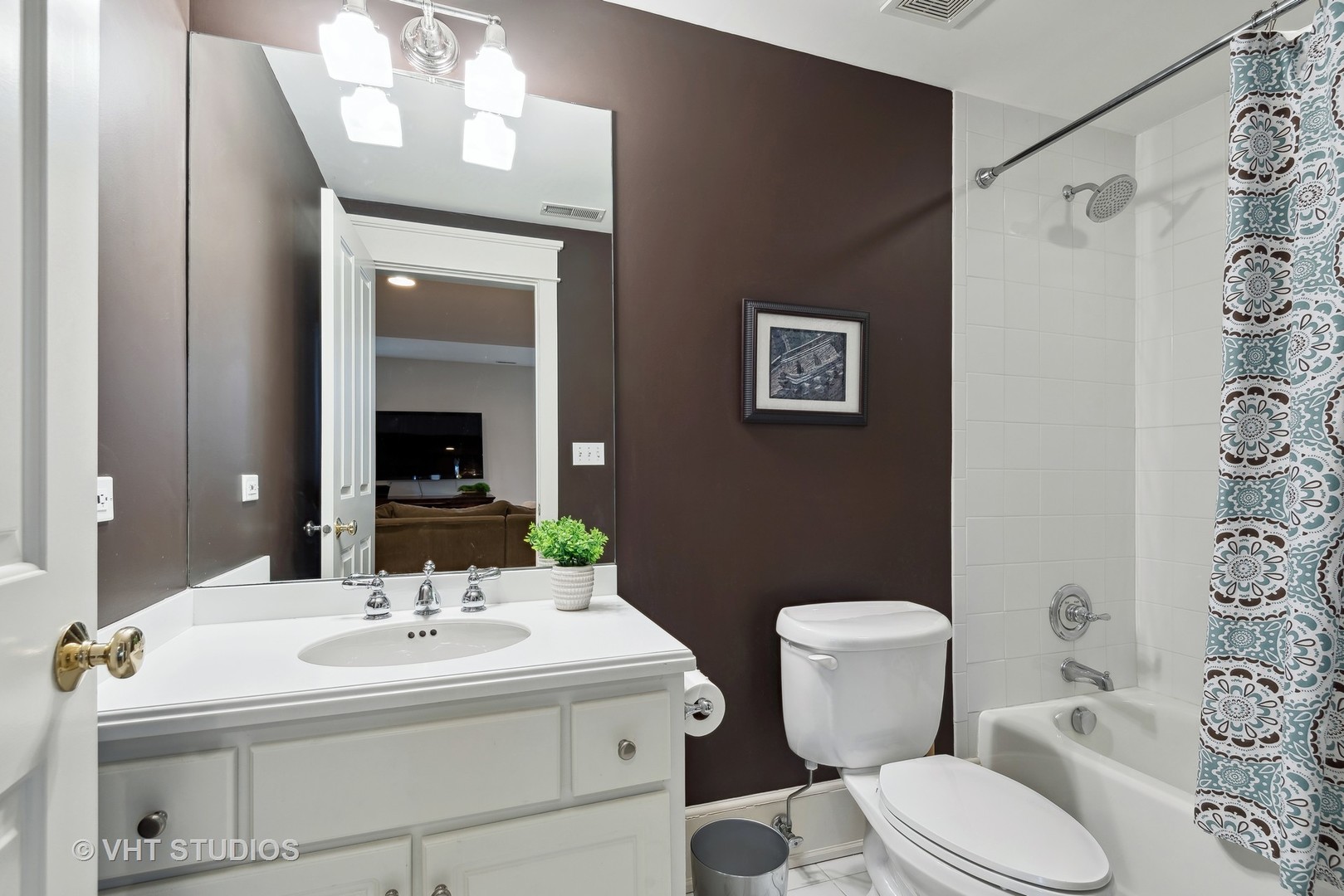 1411 Maple Avenue Wilmette, IL 60091 - Photo 25 of 41 a bathroom with a sink a toilet and mirror