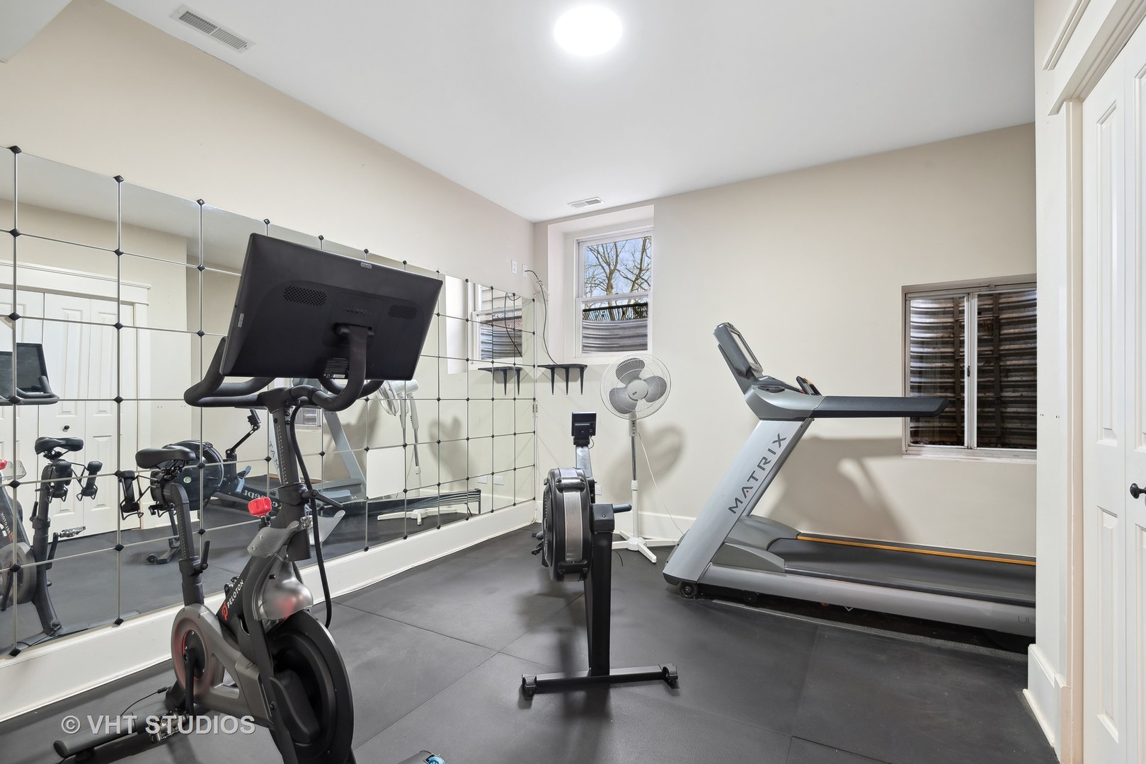 1411 Maple Avenue Wilmette, IL 60091 - Photo 26 of 41 a room with gym equipment and windows