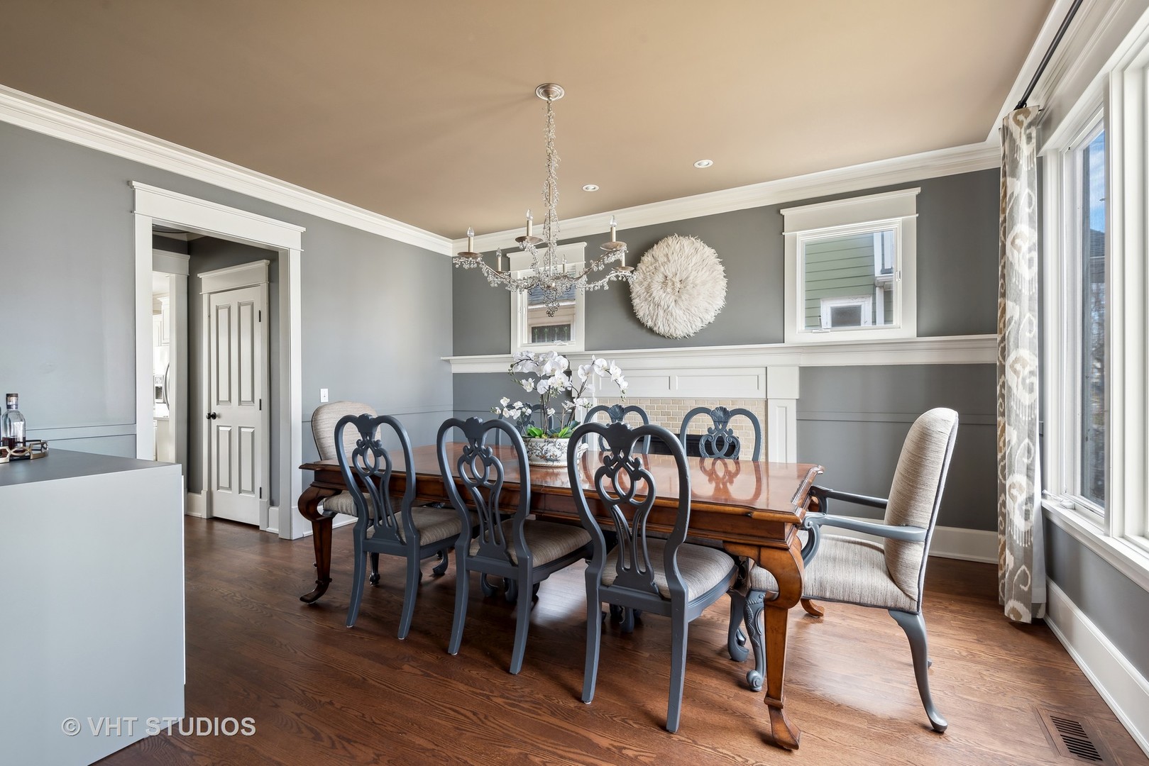 1411 Maple Avenue Wilmette, IL 60091 - Photo 4 of 41 a view of a dining room and livingroom with furniture wooden floor and a rug