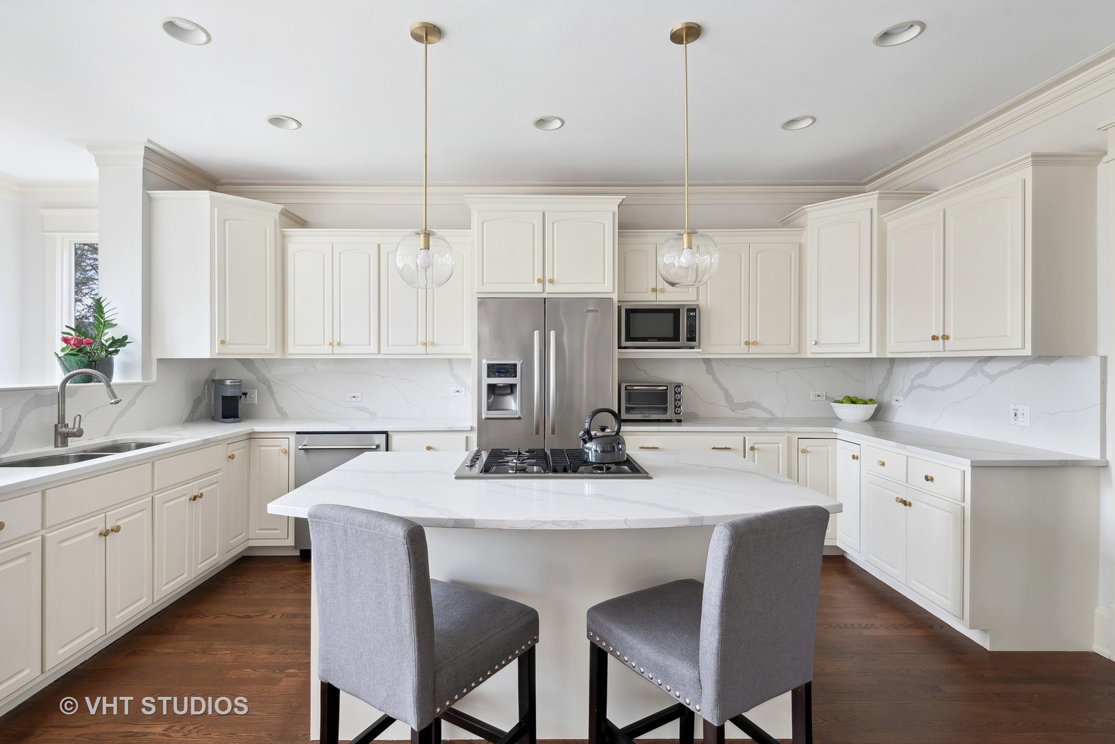 1411 Maple Avenue Wilmette, IL 60091 - Photo 5 of 41 a kitchen with kitchen island granite countertop a sink a center island and cabinets
