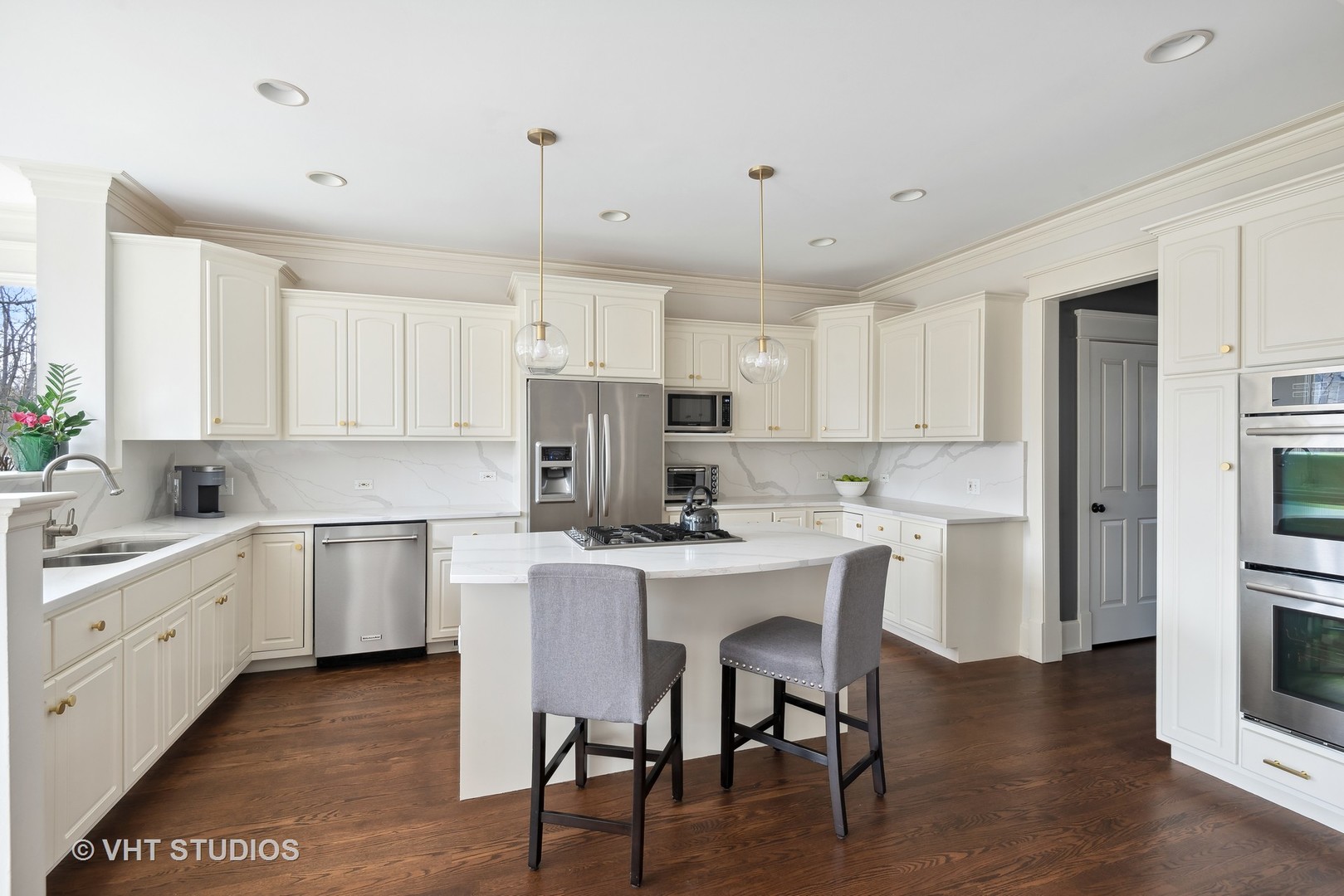 1411 Maple Avenue Wilmette, IL 60091 - Photo 6 of 41 a kitchen with a white cabinets and chairs