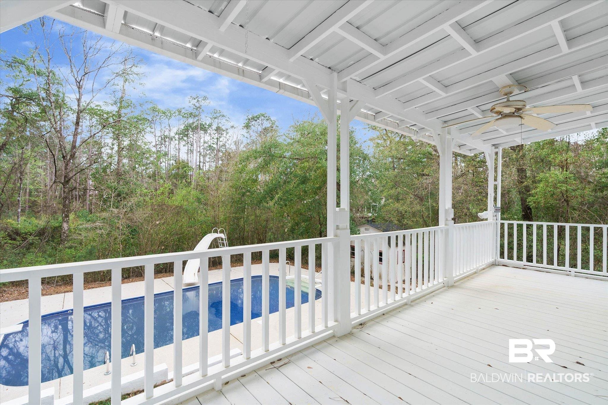 106 Melanie Loop Daphne, AL 36526 - Photo 33 of 45 Wooden deck featuring a ceiling fan and an outdoor pool