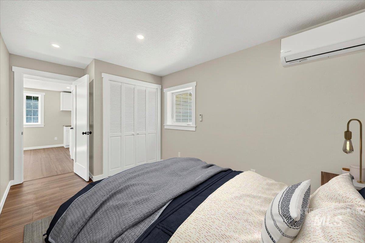 109 Parma Road Parma, ID 83660 - Photo 15 of 31 Interior room with luxury plank flooring, recessed lighting, and a white split air conditioning unit