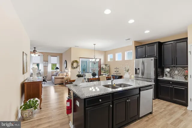 a large kitchen with lots of counter space and stainless steel appliances