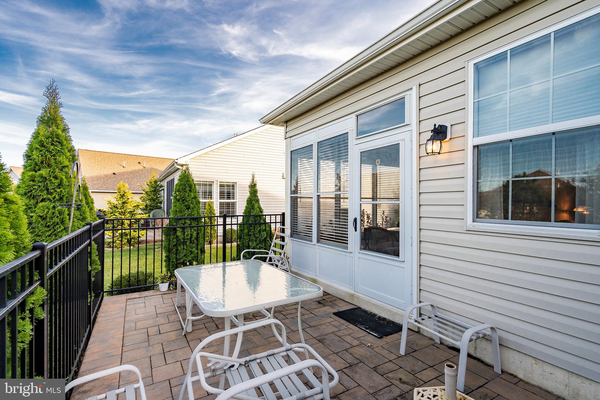 16 Raccoon Lane Barnegat, NJ 08005 - Photo 23 of 31 a view of a patio with a table and chairs
