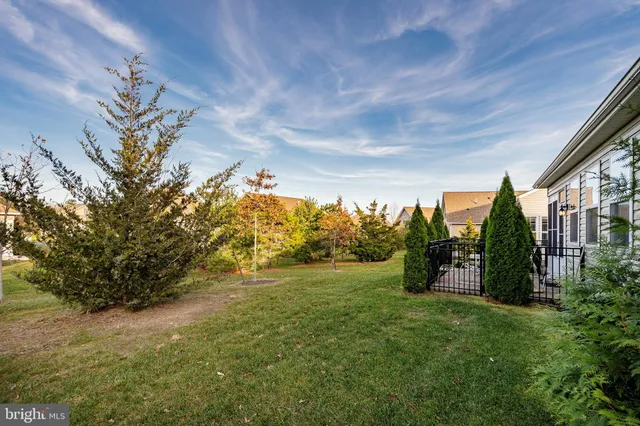 a view of outdoor space with garden and trees