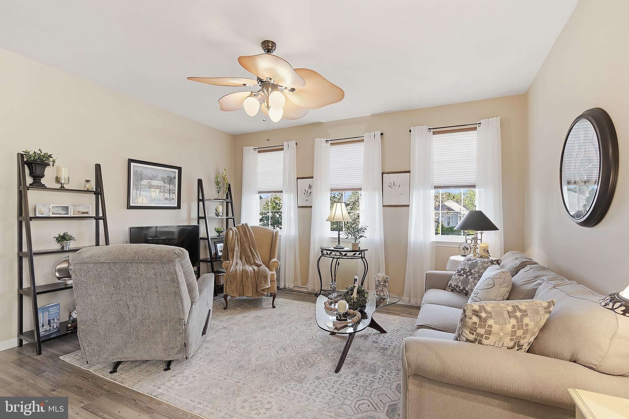 16 Raccoon Lane Barnegat, NJ 08005 - Photo 4 of 31 a living room with furniture a chandelier fan and a large window
