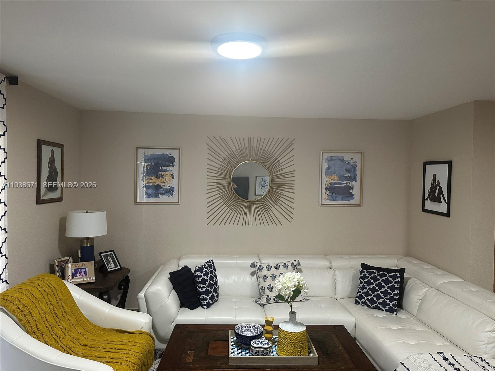 5954 Royal Way Tamarac, FL 33321 - Photo 13 of 28 a living room with furniture and a couch