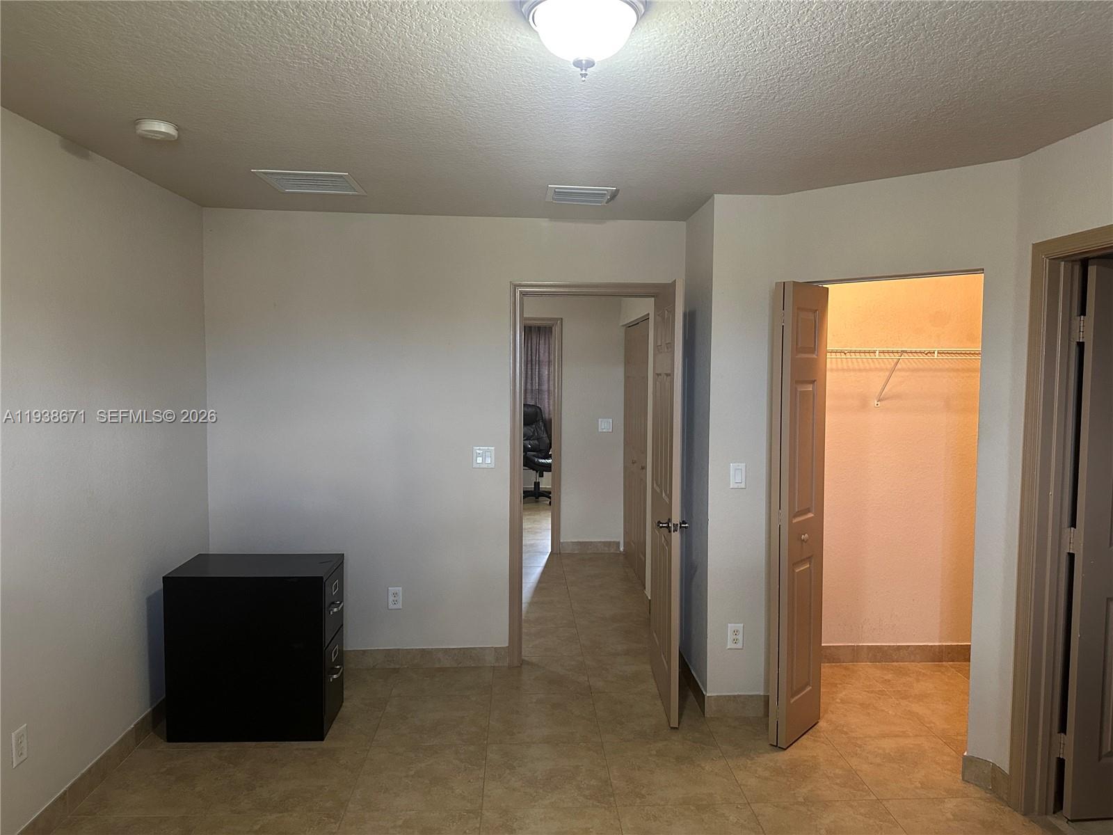 5954 Royal Way Tamarac, FL 33321 - Photo 23 of 28 an empty room with closet and a bathroom