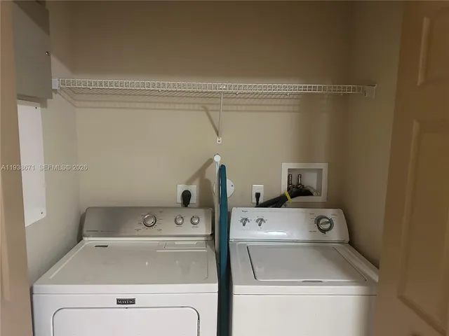 a view of swimming pool with outdoor seating and covered with trees