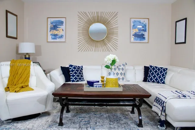 a dining room with furniture and chandelier