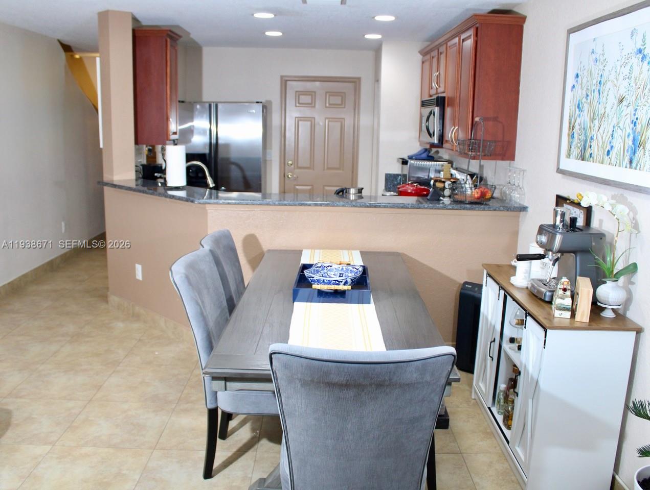 5954 Royal Way Tamarac, FL 33321 - Photo 8 of 28 a dining room with furniture and chandelier