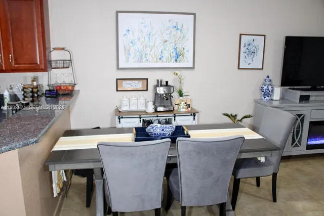 a kitchen with stainless steel appliances granite countertop a stove sink and microwave