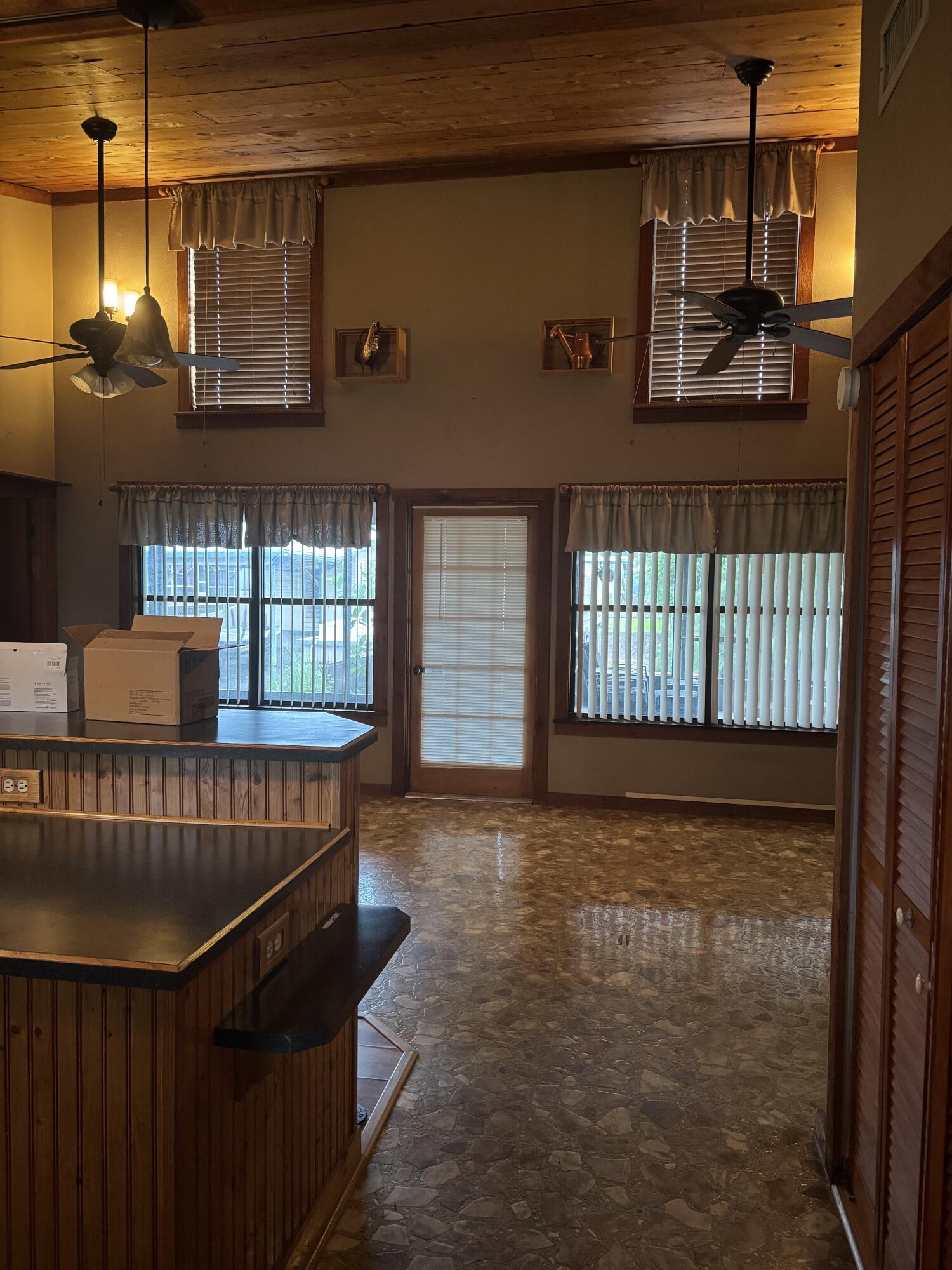 9636 Southwest Adams Avenue Okeechobee, FL 34974 - Photo 11 of 38 a view of entryway and hall with wooden floor