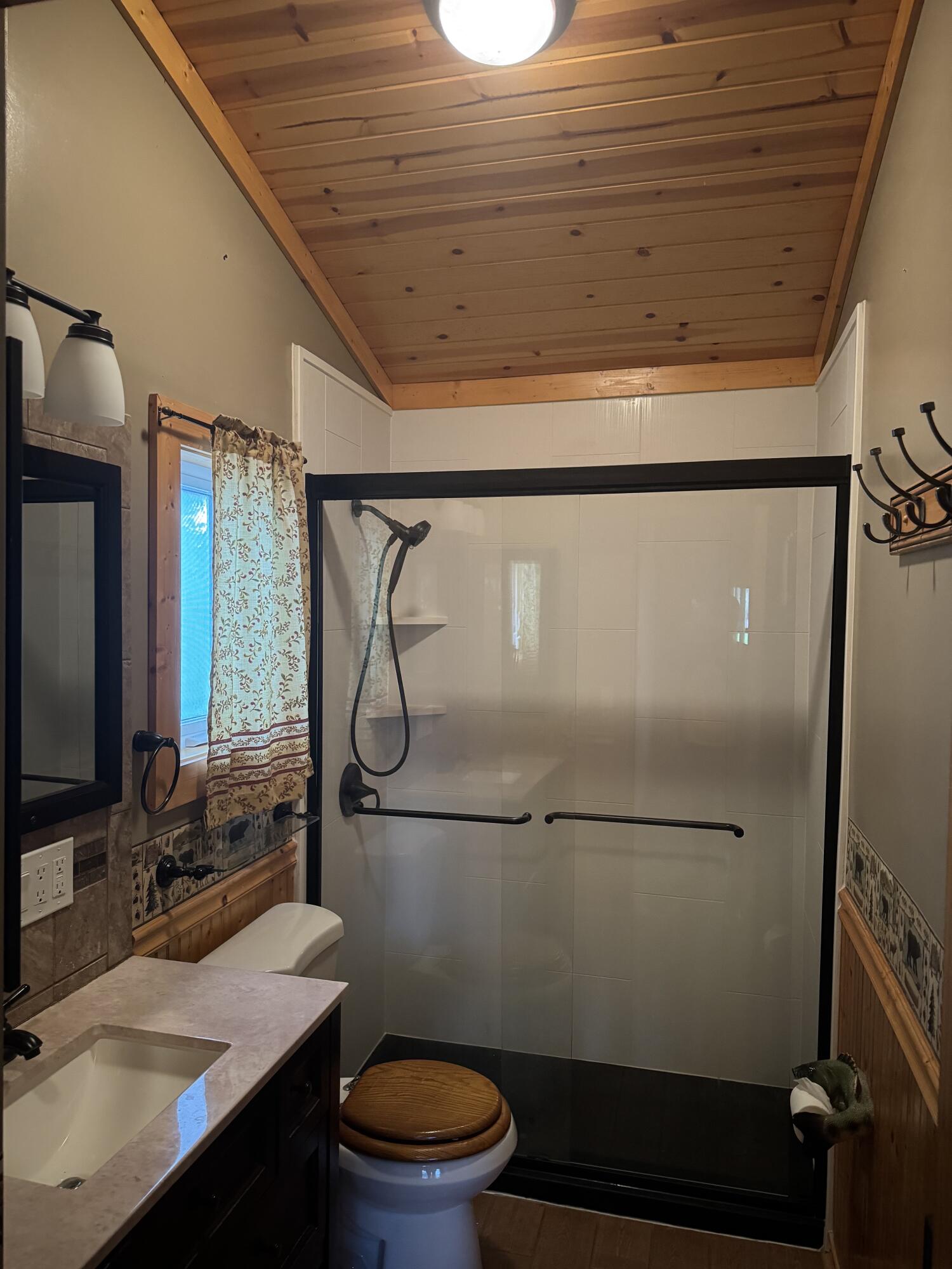 9636 Southwest Adams Avenue Okeechobee, FL 34974 - Photo 12 of 38 a bathroom with a granite countertop sink toilet and shower
