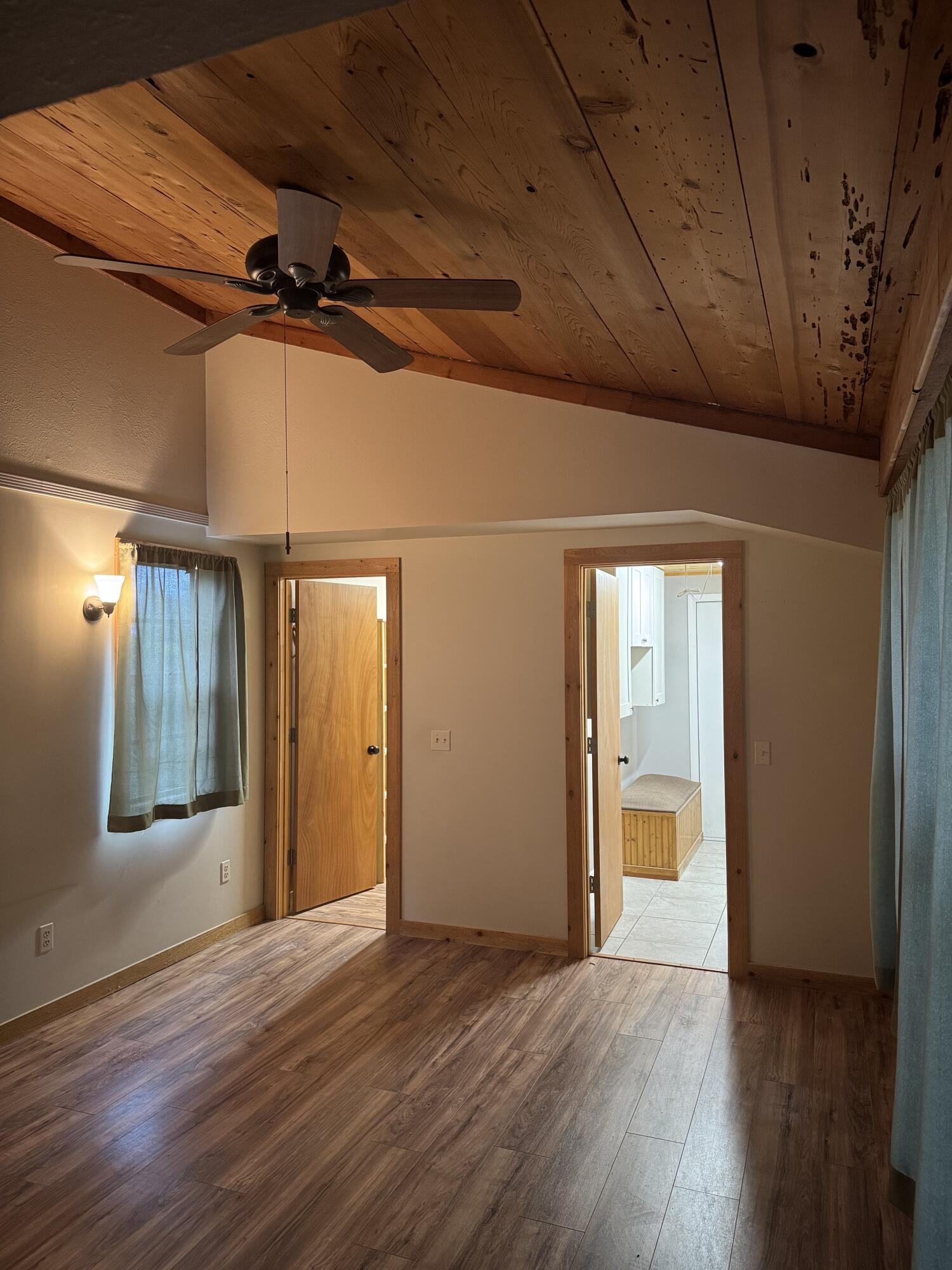 9636 Southwest Adams Avenue Okeechobee, FL 34974 - Photo 16 of 38 a view of an empty room with wooden floor and a window