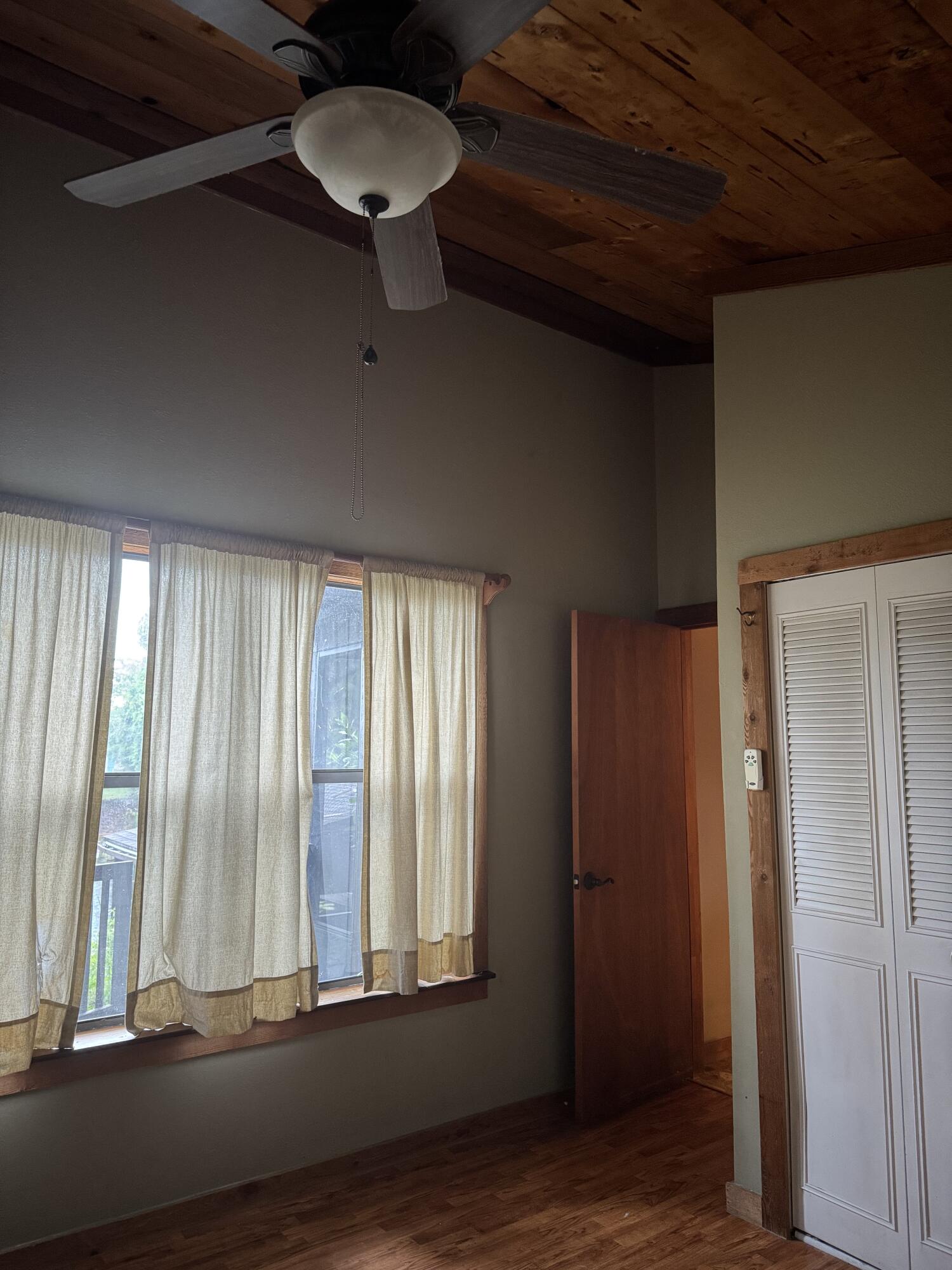 9636 Southwest Adams Avenue Okeechobee, FL 34974 - Photo 18 of 38 a view of a room with a ceiling fan and window