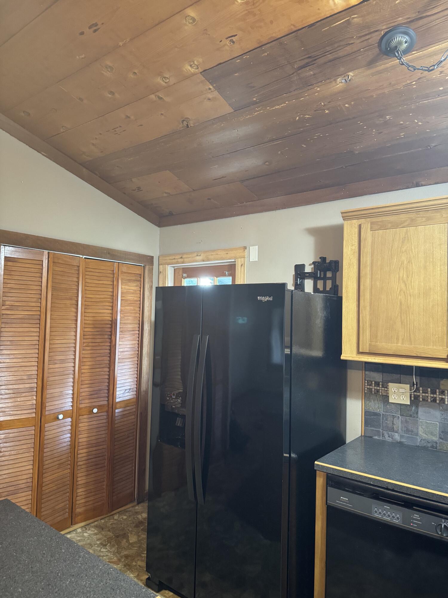 9636 Southwest Adams Avenue Okeechobee, FL 34974 - Photo 28 of 38 a kitchen with a refrigerator and a sink