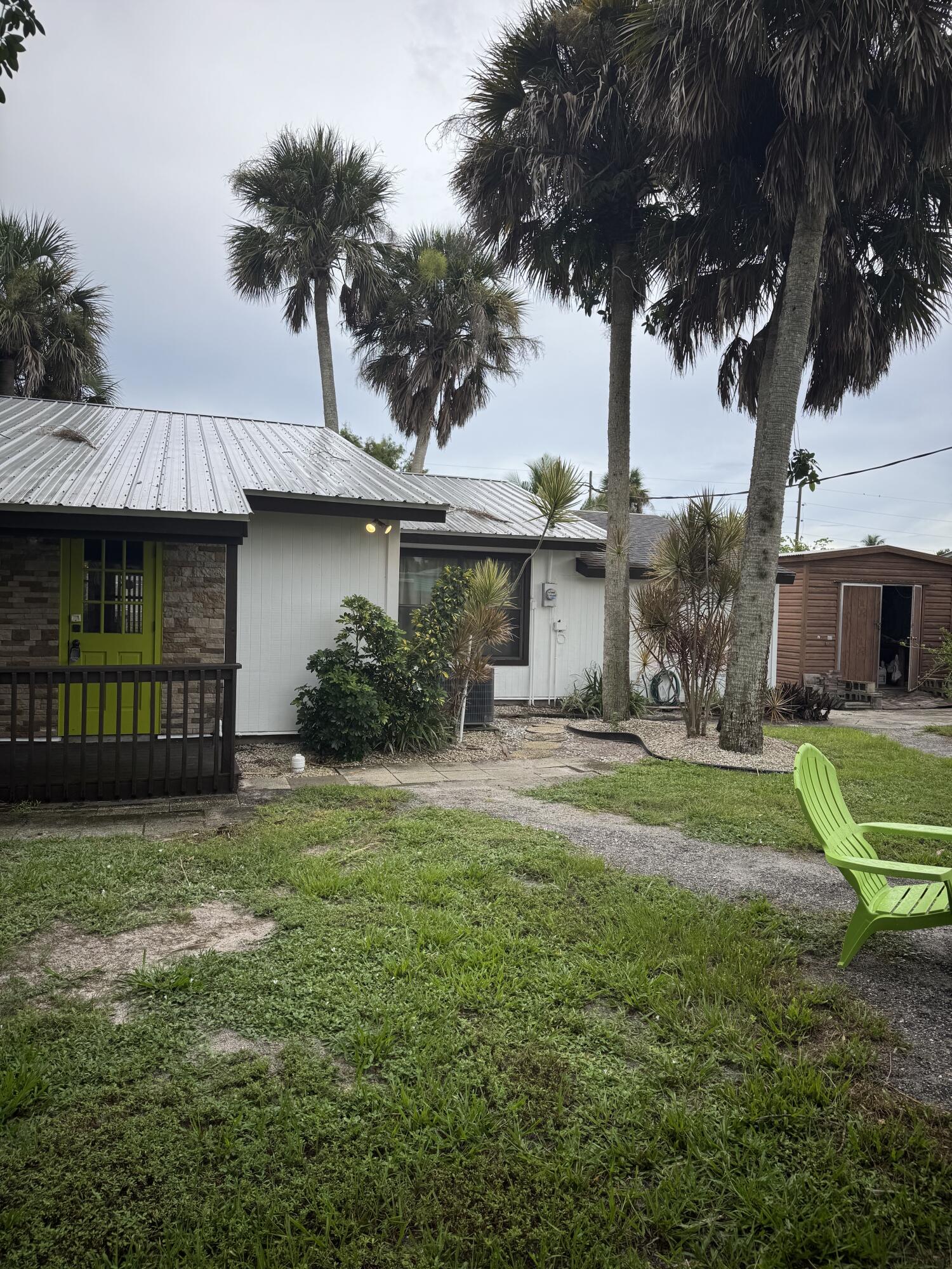9636 Southwest Adams Avenue Okeechobee, FL 34974 - Photo 3 of 38 a view of a house with a yard and a patio