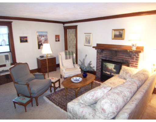 38 Robbins Road Arlington, MA 02476 - Photo 6 of 16 a living room with furniture and a fireplace