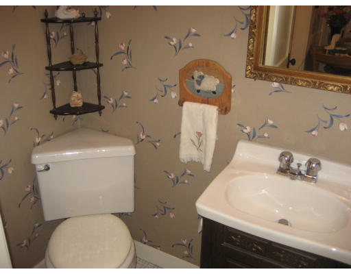 38 Robbins Road Arlington, MA 02476 - Photo 9 of 16 a white toilet sitting next to a bathroom sink