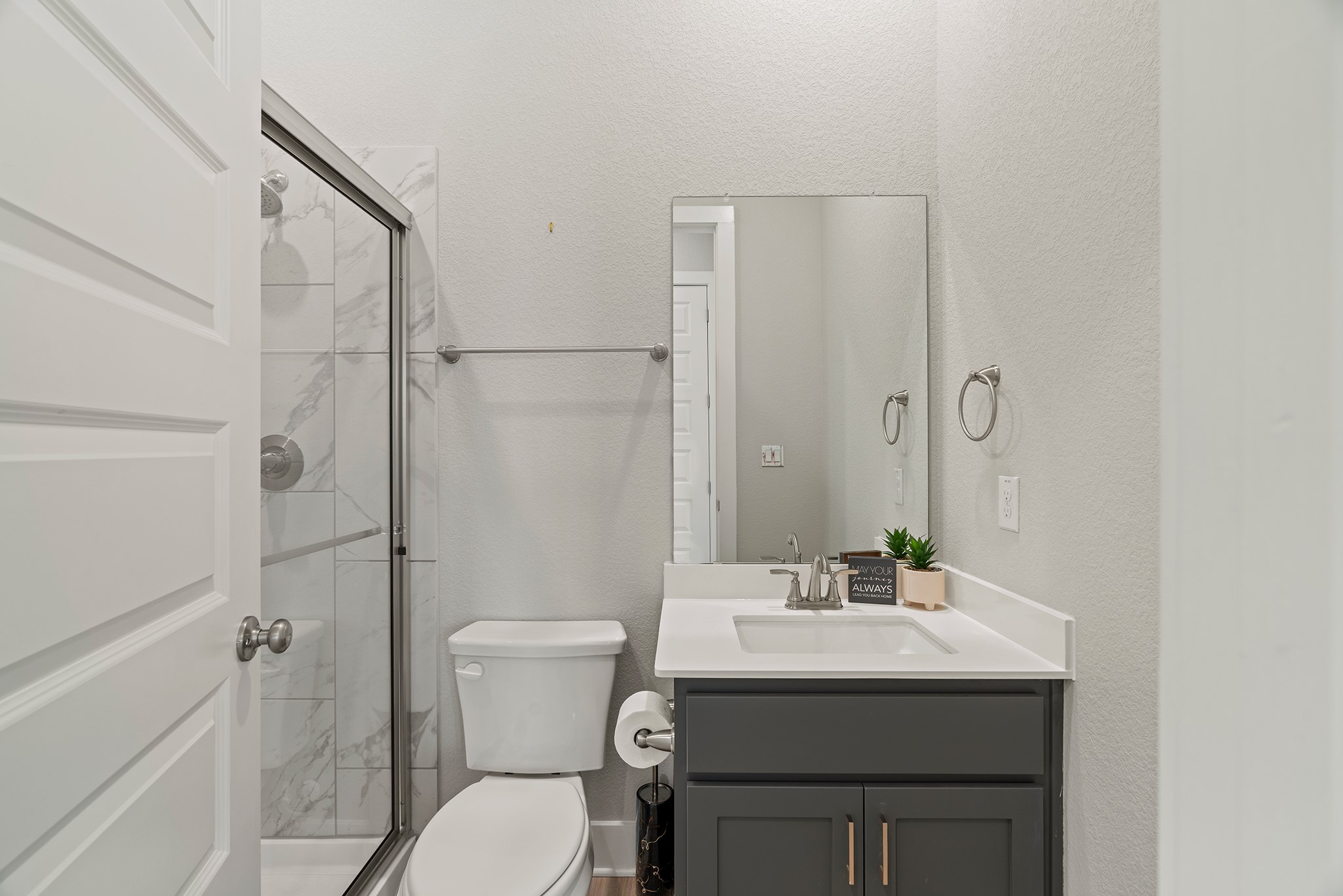 2112 Tobiano Trace Georgetown, TX 78633 - Photo 24 of 40 Bathroom with a textured wall, a marble finish shower, and vanity