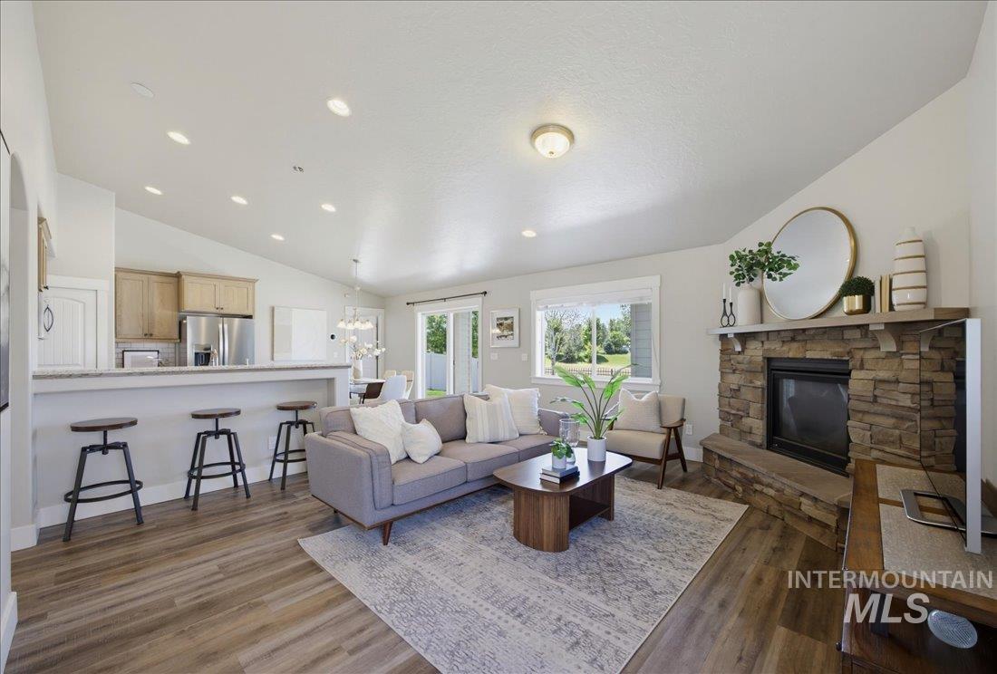 5317 West Lockner Street Eagle, ID 83616 - Photo 11 of 34 Living area, dining table space and kitchen are open and perfect for entertaining.