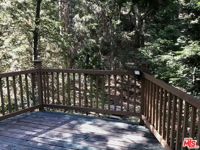 a living room with a fireplace and a flat screen tv
