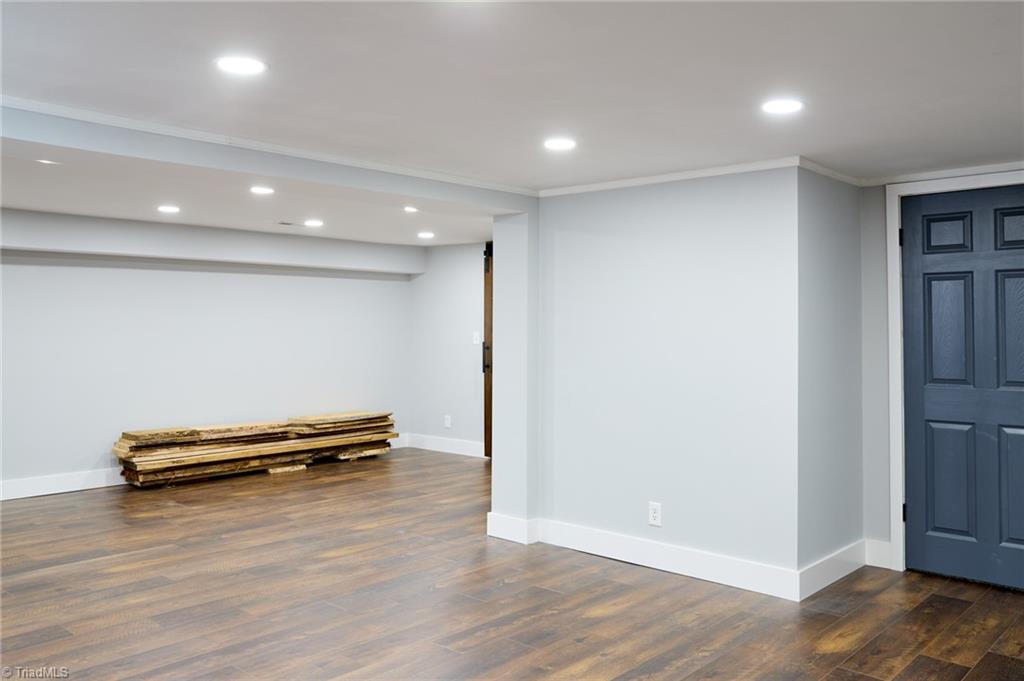 35 Edith Avenue Winston-Salem, NC 27106 - Photo 39 of 45 Basement den. Door leads to large storage room/flex space with no windows
