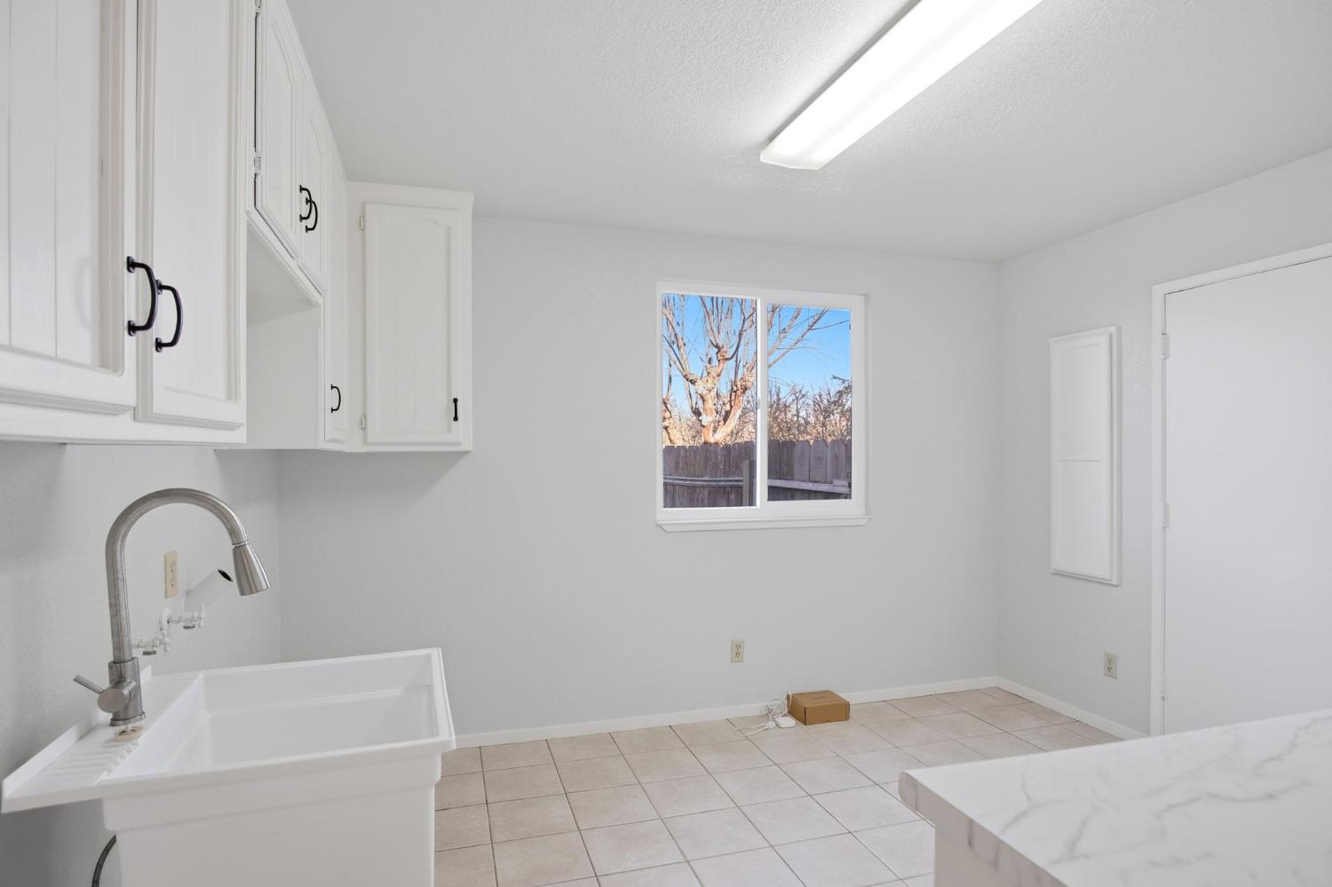 16166 Lawrence Road Escalon, CA 95320 - Photo 17 of 56 a bathroom with a sink and a bathtub