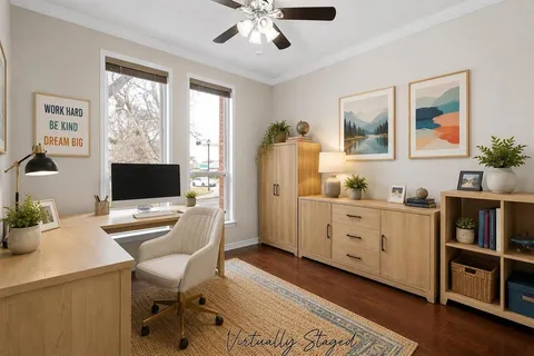 a workspace with furniture window and wooden floor