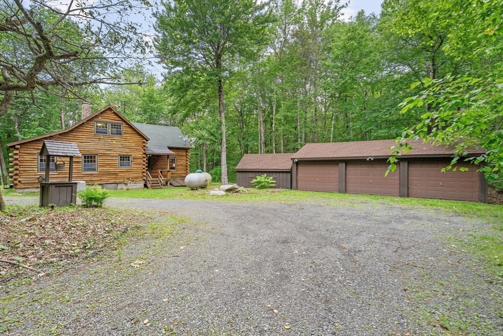 116 Skyline Trail Middlefield, MA 01235 - Photo 2 of 37 a front view of a house with garden