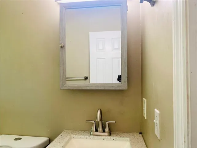 a bathroom with a sink and a toilet