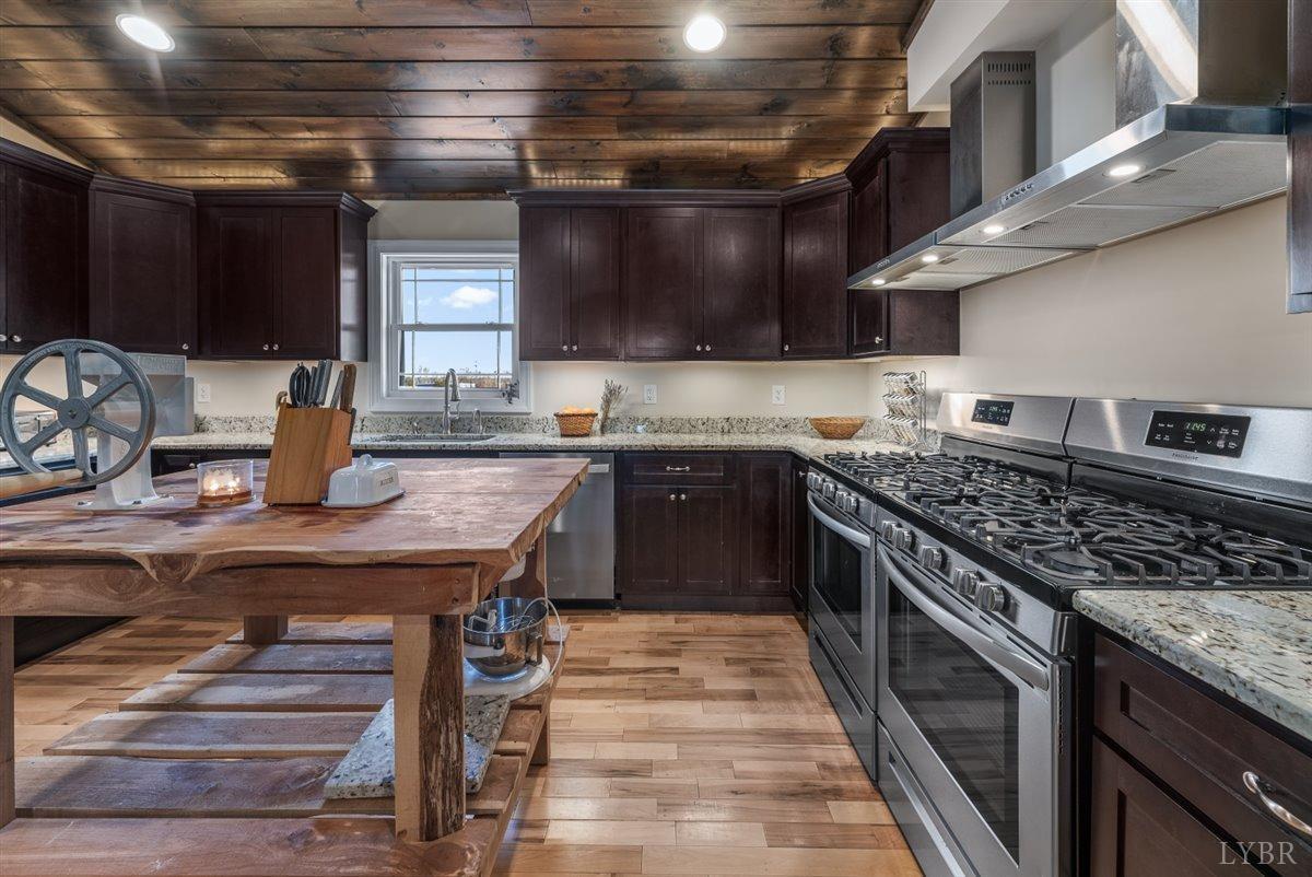 4625 Lowry Road Goode, VA 24556 - Photo 11 of 56 a kitchen with a stove and a sink