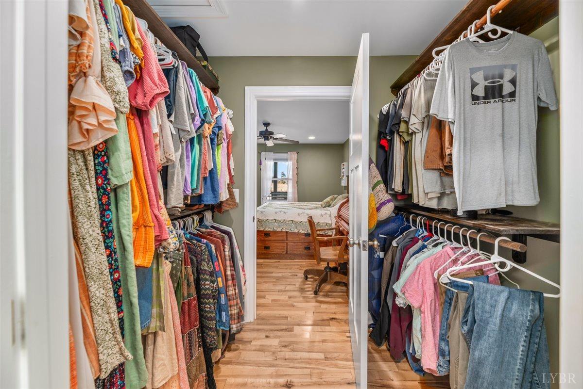 4625 Lowry Road Goode, VA 24556 - Photo 19 of 56 a view of walk in closet with clothes