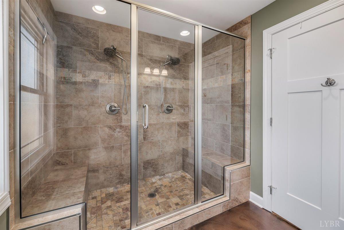 4625 Lowry Road Goode, VA 24556 - Photo 20 of 56 a bathroom with a glass shower door