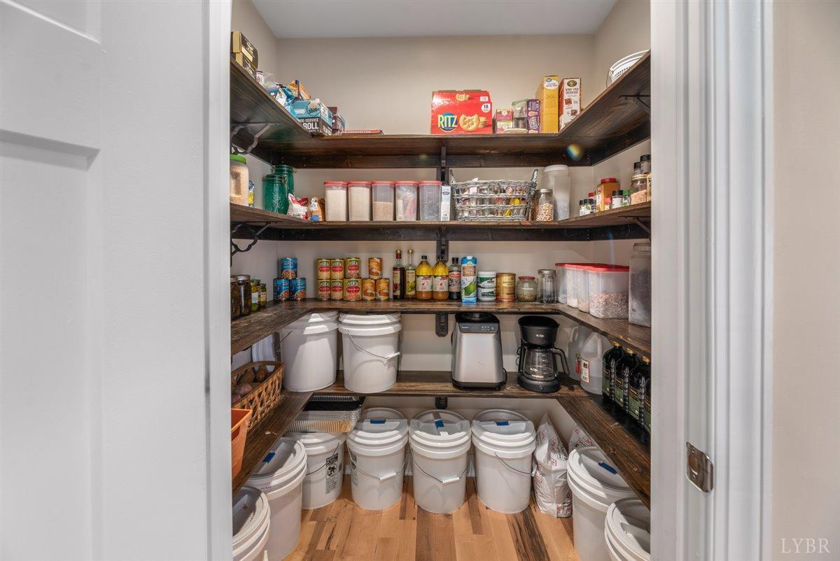 4625 Lowry Road Goode, VA 24556 - Photo 29 of 56 a room with granite countertop lots of different kinds of food