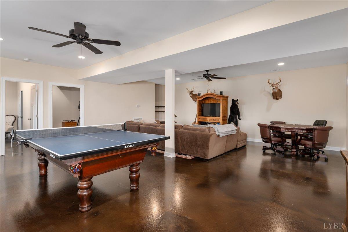 4625 Lowry Road Goode, VA 24556 - Photo 32 of 56 a living room with furniture and a table