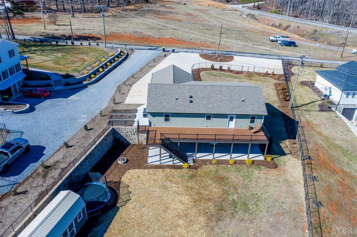 4625 Lowry Road Goode, VA 24556 - Photo 45 of 56 a view of a balcony with two chairs and a large tree
