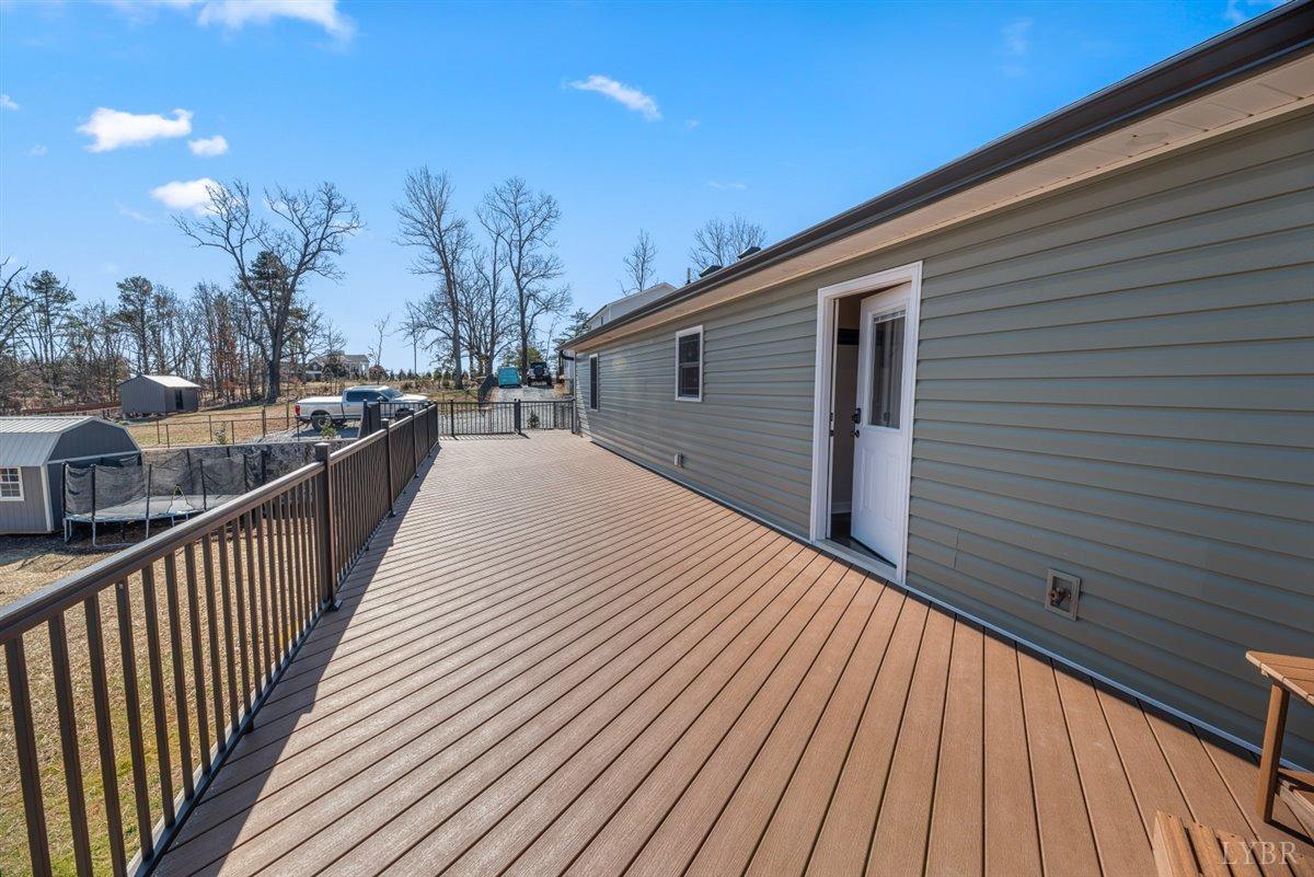 4625 Lowry Road Goode, VA 24556 - Photo 47 of 56 a view of a house with wooden deck