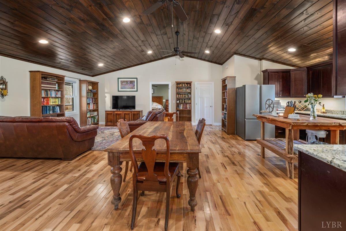 4625 Lowry Road Goode, VA 24556 - Photo 7 of 56 a view of a dining room with furniture window and wooden floor