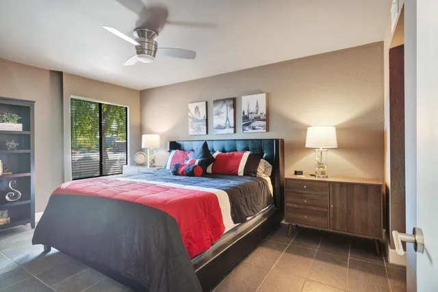 a bedroom with a bed and window